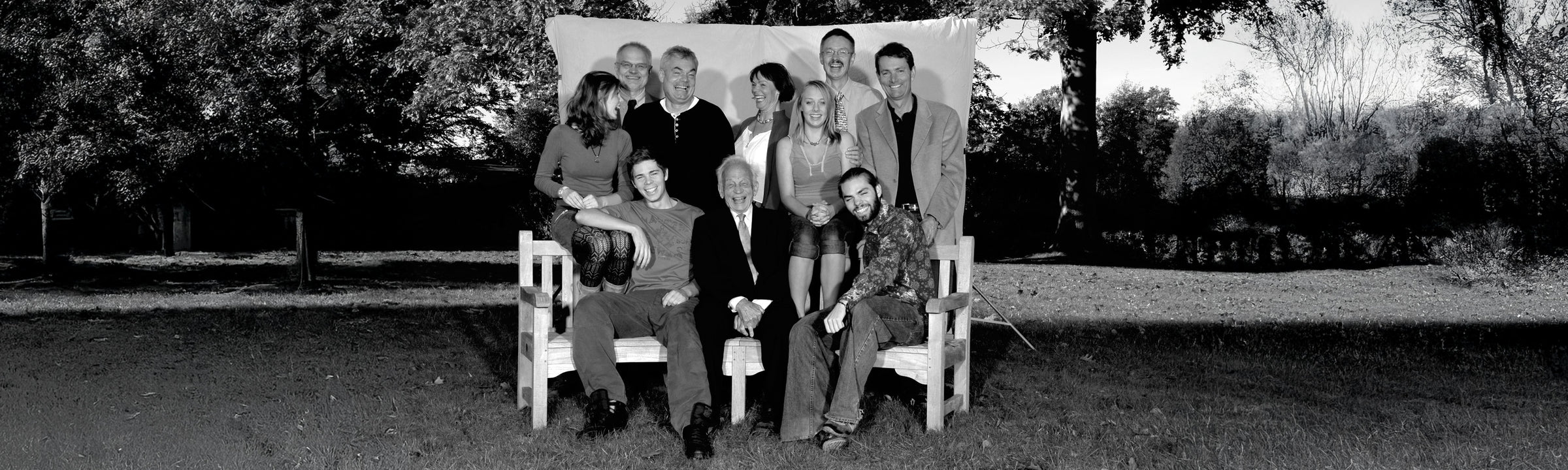 Black and white photo of the trollbeads family posing outdoors